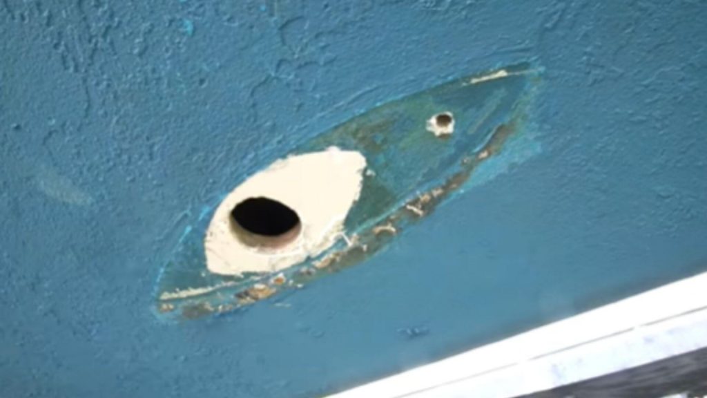 How to fix small holes in a fiberglass boat - How a small hole looks like on a boat