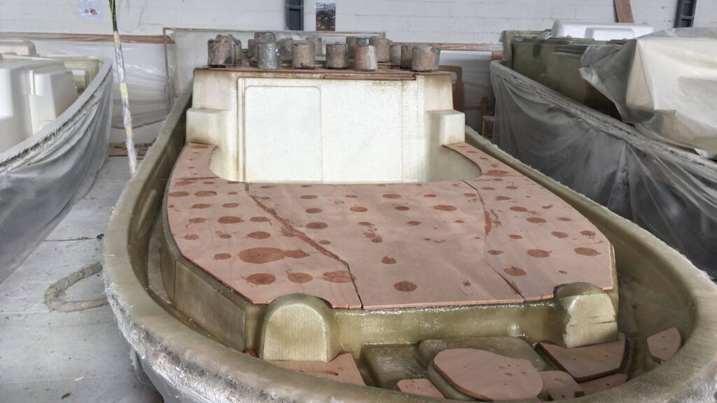 wood pressing in fiberglass boat construction